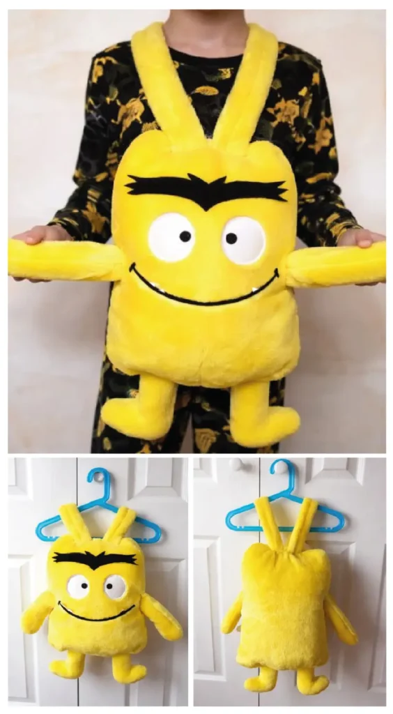 Disfraz infantil de monstruo de colores amarillo hecho a mano, mostrado por delante y por detrás.